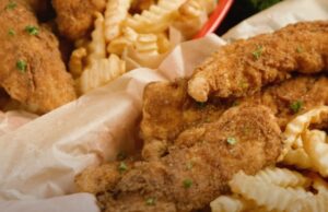 Crispy fried chicken tenders and crispy fries