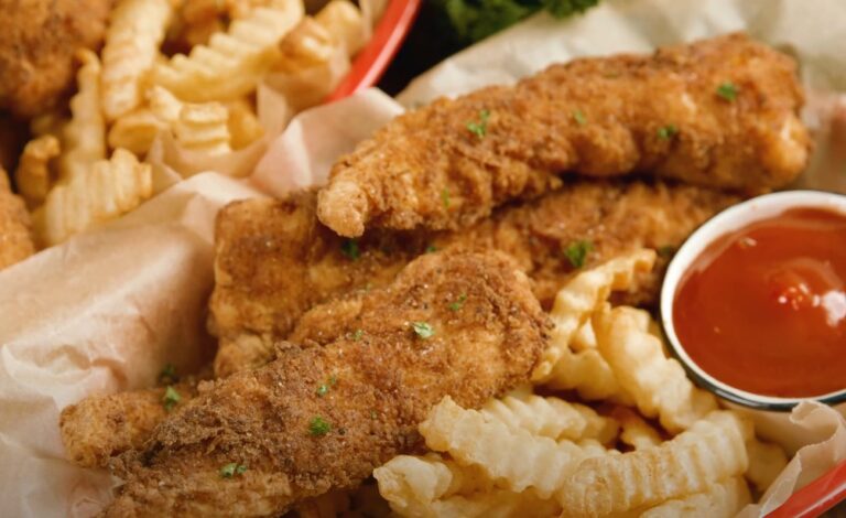 Crispy fried chicken tenders and seasoned fries