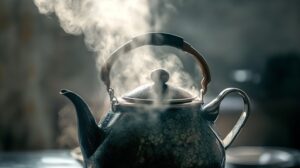 A steaming kettle releasing vapor, set in a cozy dimly lit environment