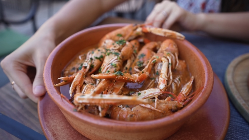 Seafood platter at The Dalmatian Bite in Split with shrimp served in a rustic clay dish